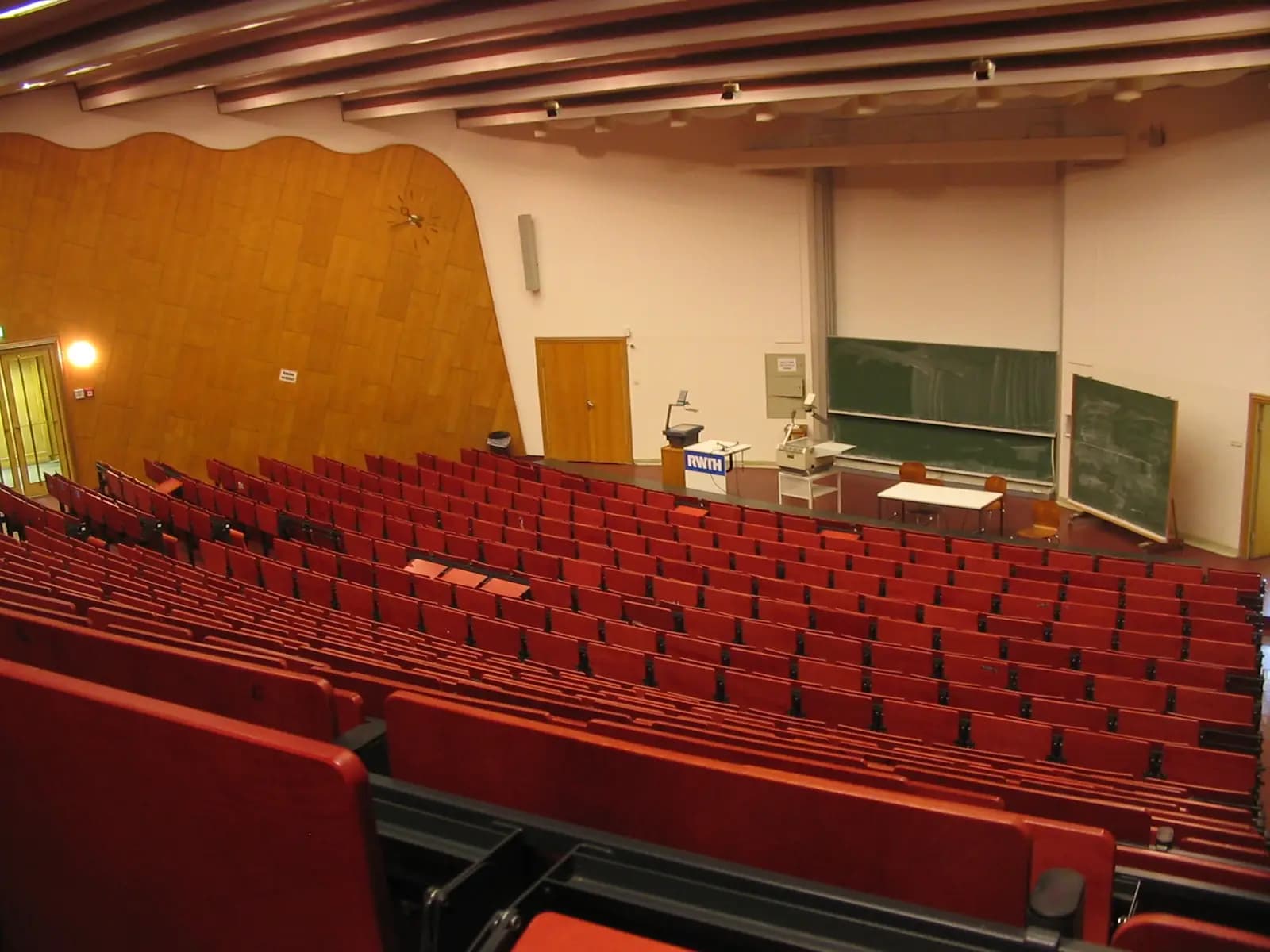 University lecture hall with red seating
