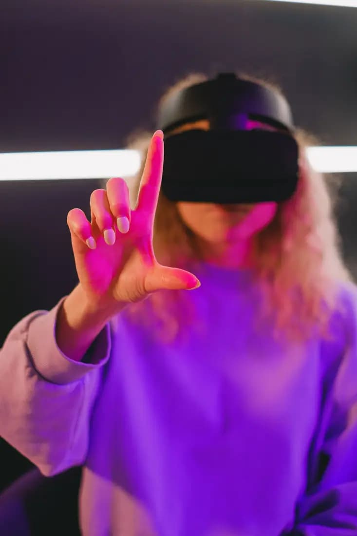 Person using a VR headset and gesturing in mid-air