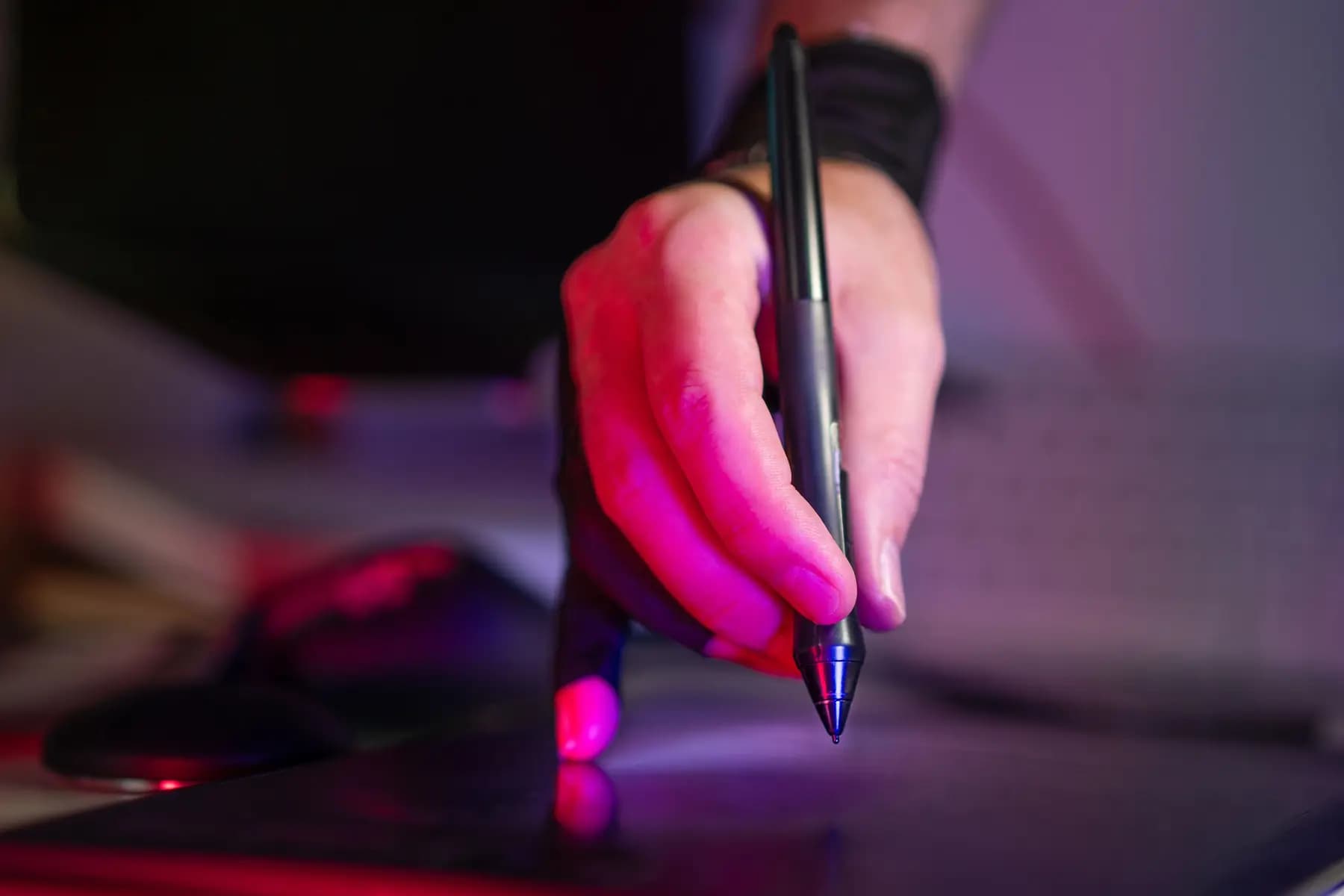 Digital artist drawing with a stylus on a graphics tablet