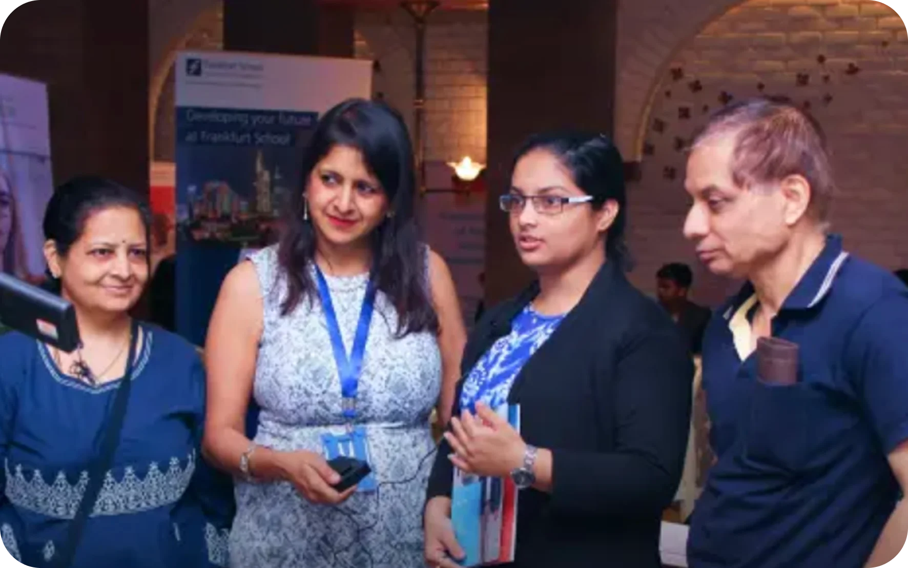 EduOptions Germany founder Renu Agarwal encouraging a student success story at Pune education fair